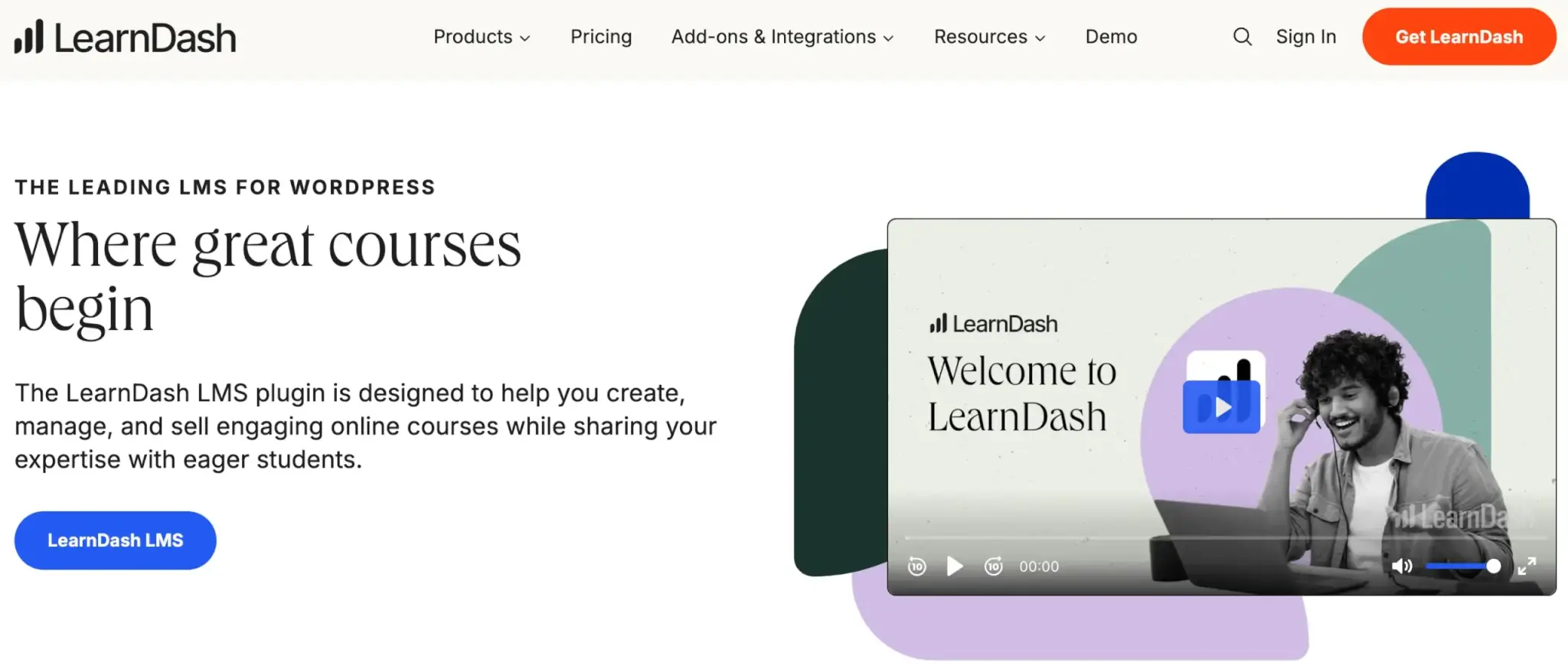 LearnDash LMS webpage featuring course creation for WordPress, with an image of a smiling person using a laptop and a play button for a welcome video. 