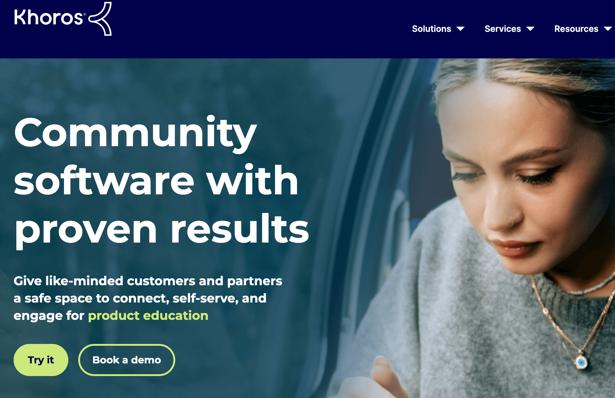  Khoros webpage promoting community software, featuring an image of a focused user, with options to try or book a demo.