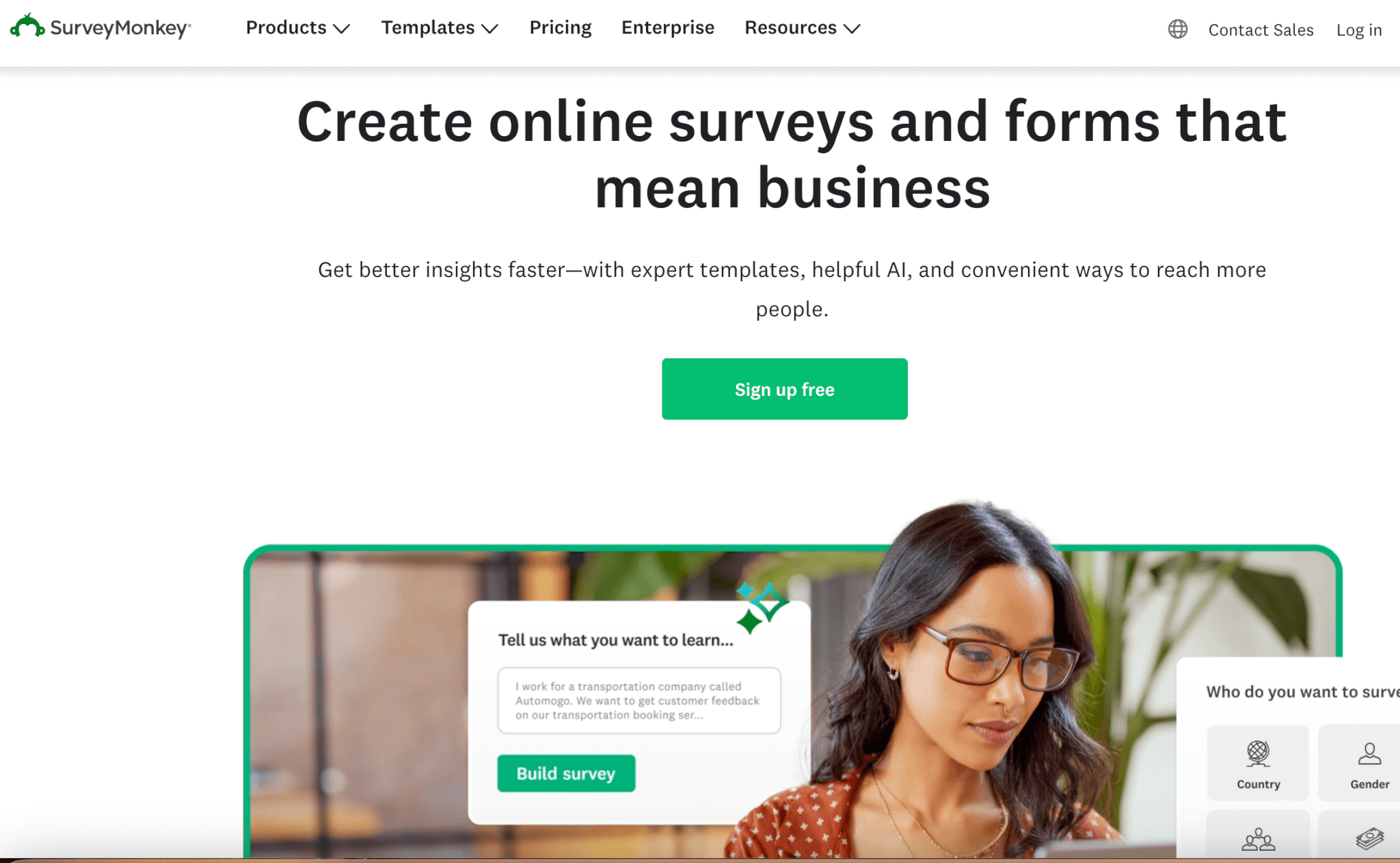 SurveyMonkey webpage featuring tools for creating online surveys, with an image of a user building a survey and a 'Sign up free' button.